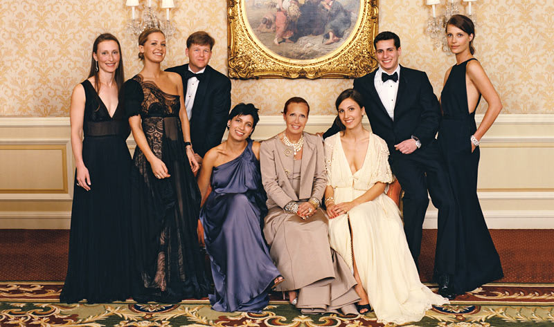 Danielle Steel, wearing a gown with her children