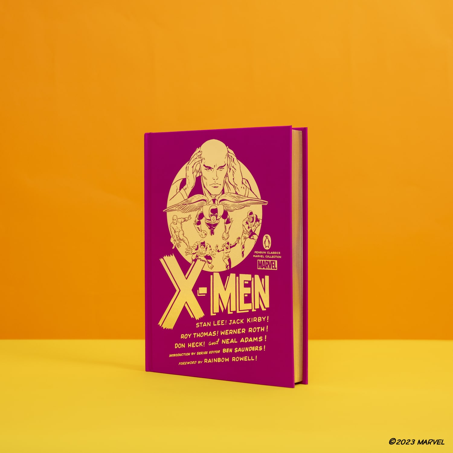 X-Men hardcover edition standing against orange background