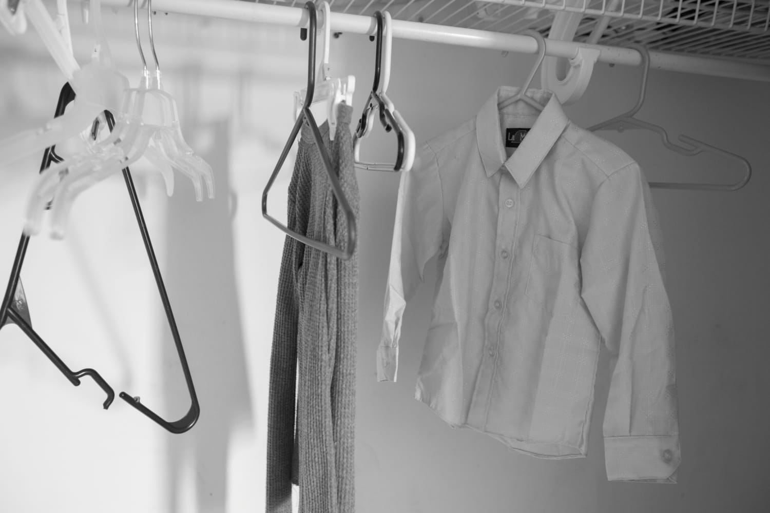 Clothes and hangers left behind in a closet