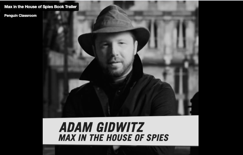 Screen shot of MAX IN THE HOUSE OF SPIES trailer showing Adam Gidwitz dressed as a spy