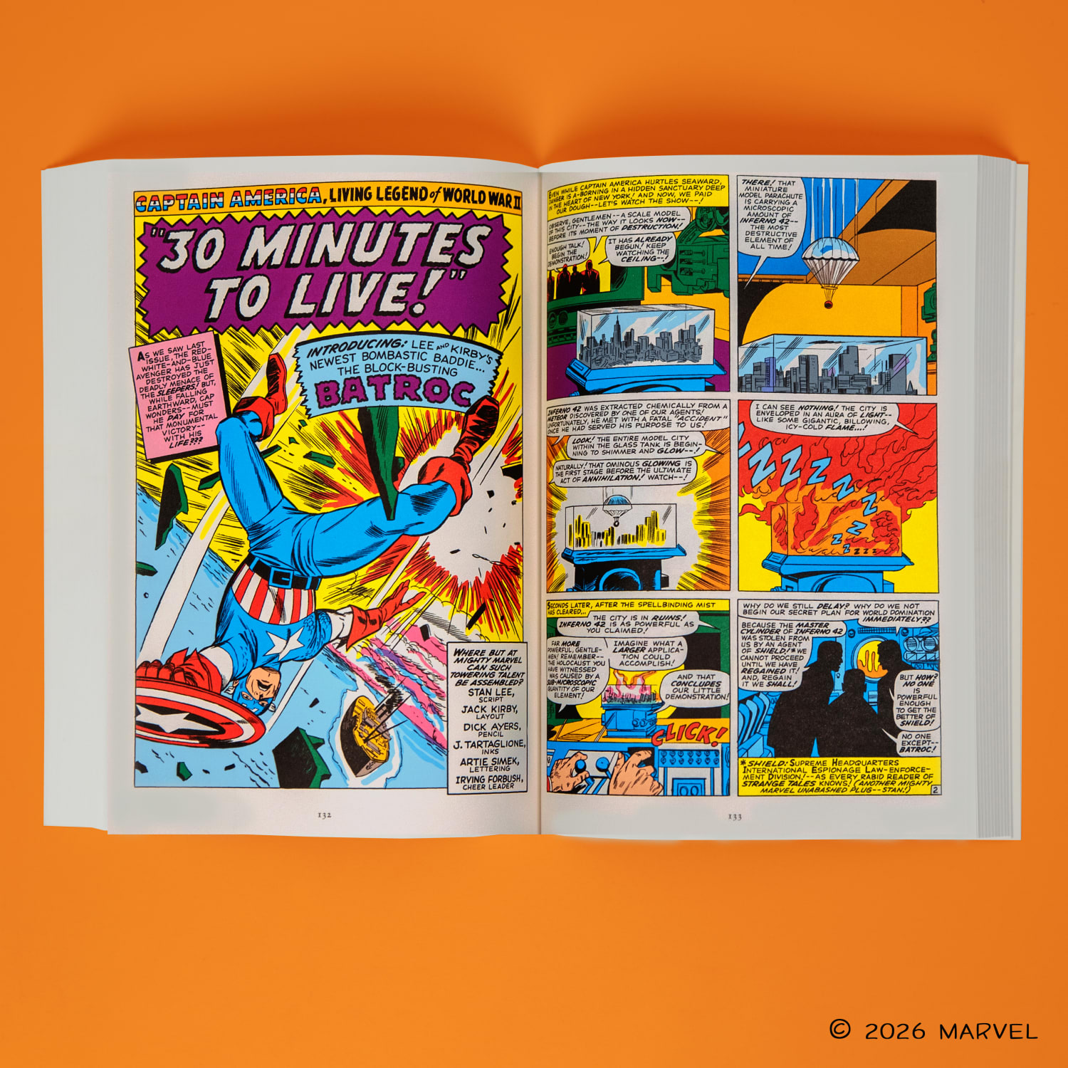 Captain America paperback laying open against an orange background