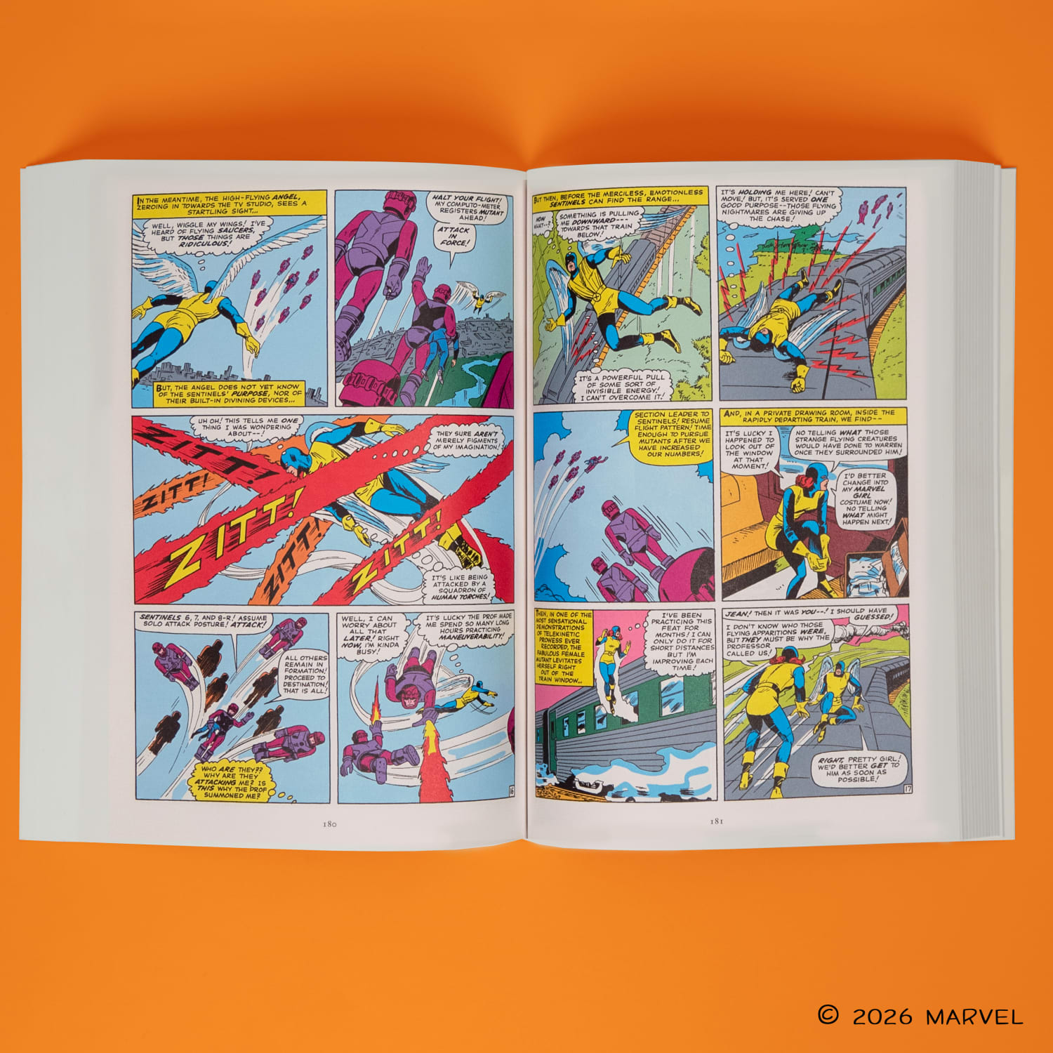 The x-men paperback laying open against an orange background