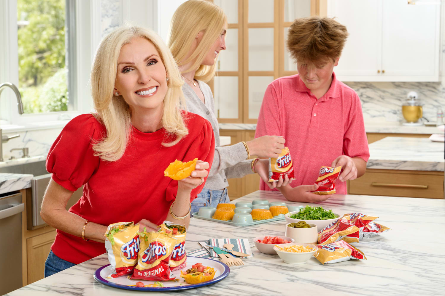 Lorafied in the Kitchen with her kids and fritolay taco cups