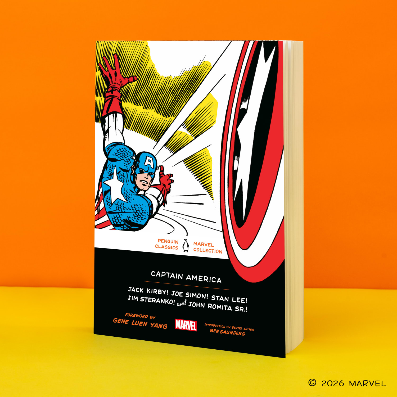 Captain America paperback standing at an angle against an orange background