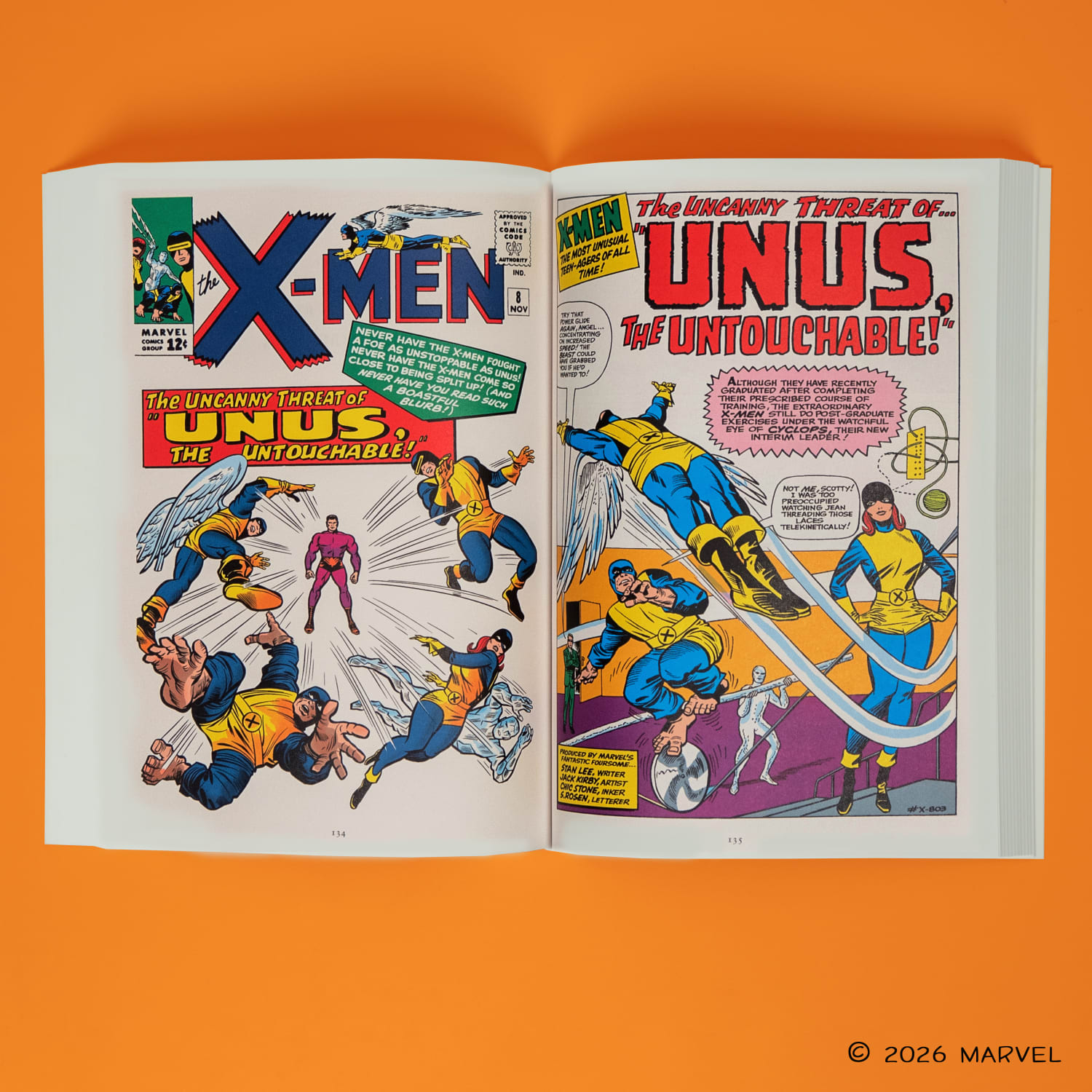 The x-men paperback laying open against an orange background