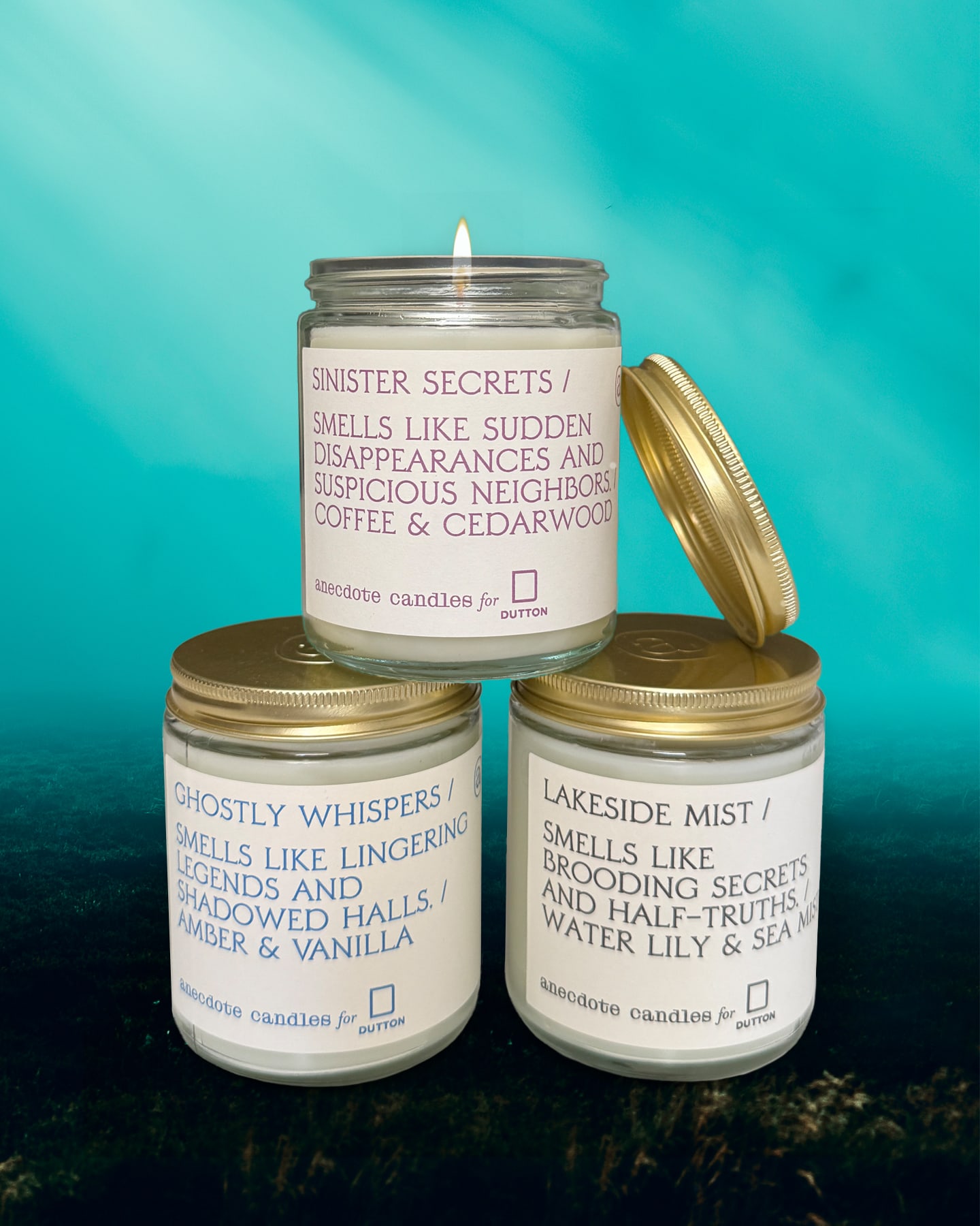 Three candles themed to Riley Sager's books