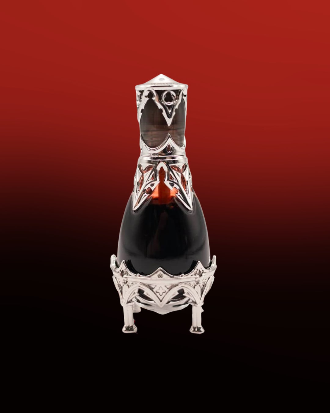 One bottle of a bloody lip tint accented with silver designs in front of a red and black background