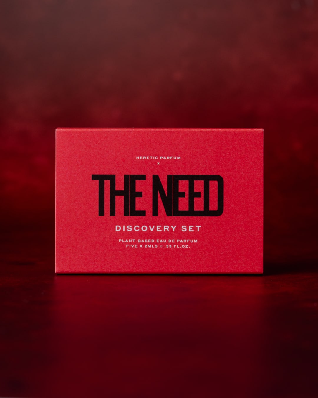 One small perfume box with the text The Need Discovery Set
