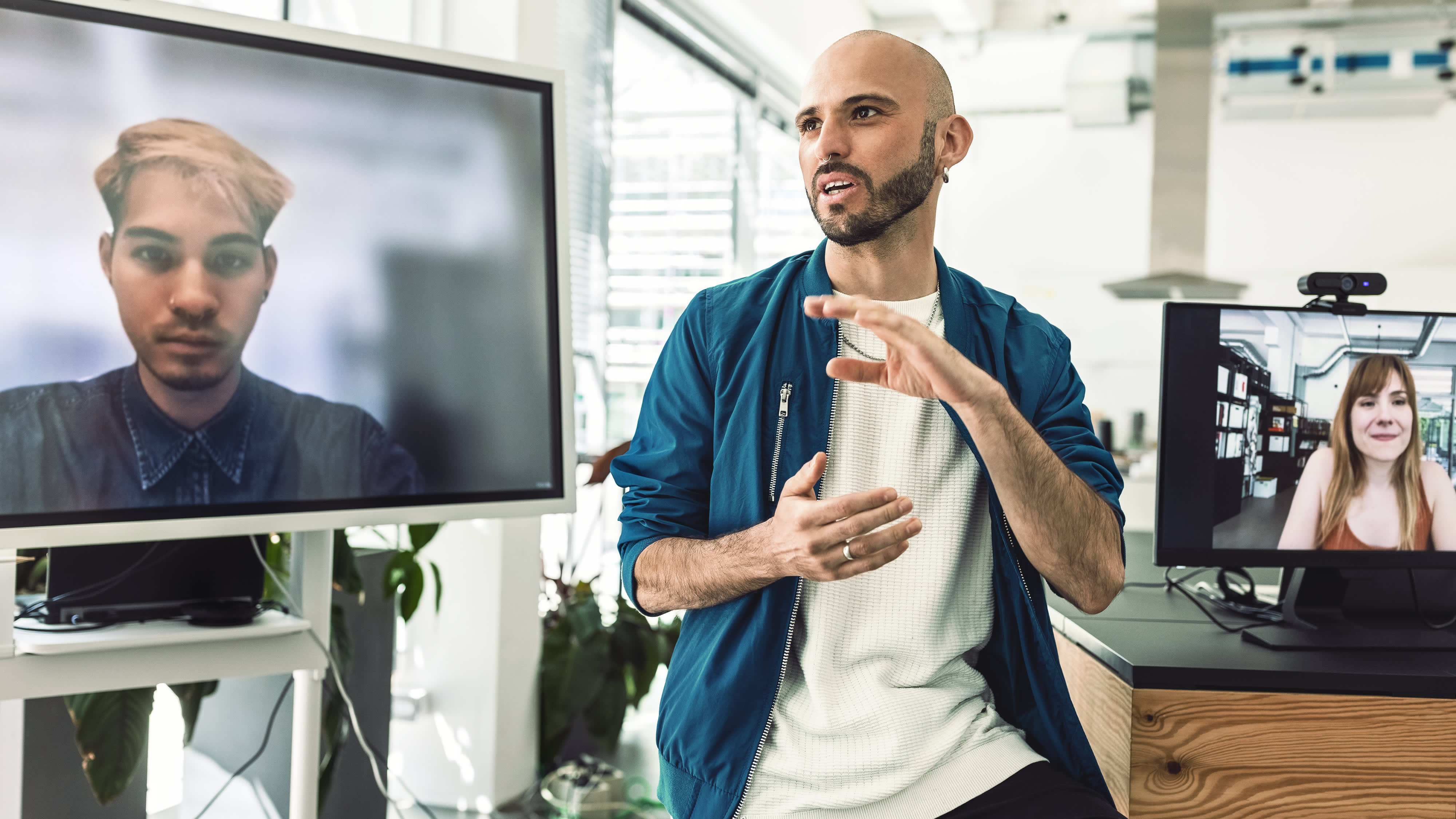 Man having online meeting with coworker working remotely