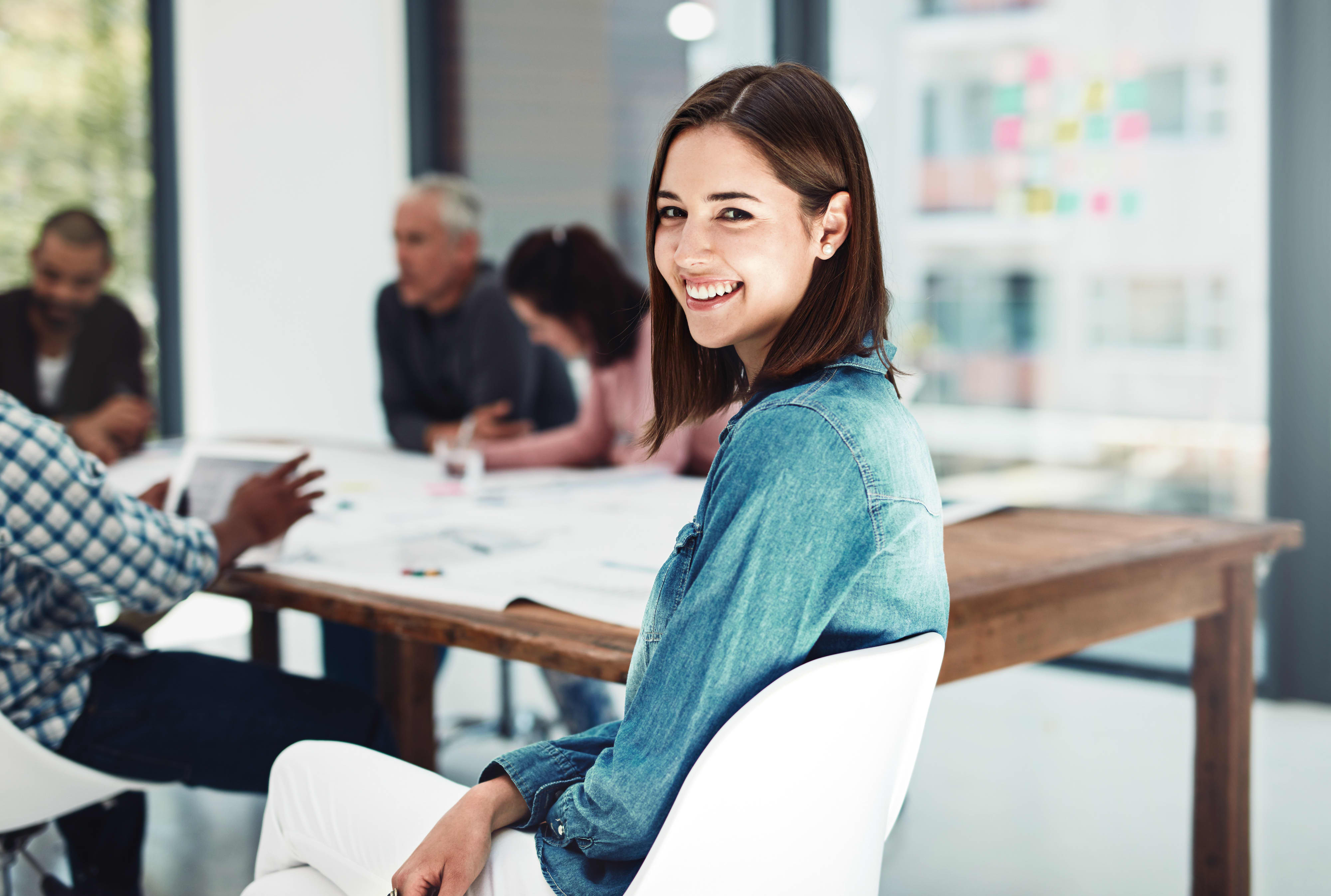 Portrait of an attractive young woman sitting in the boardroom during a meeting