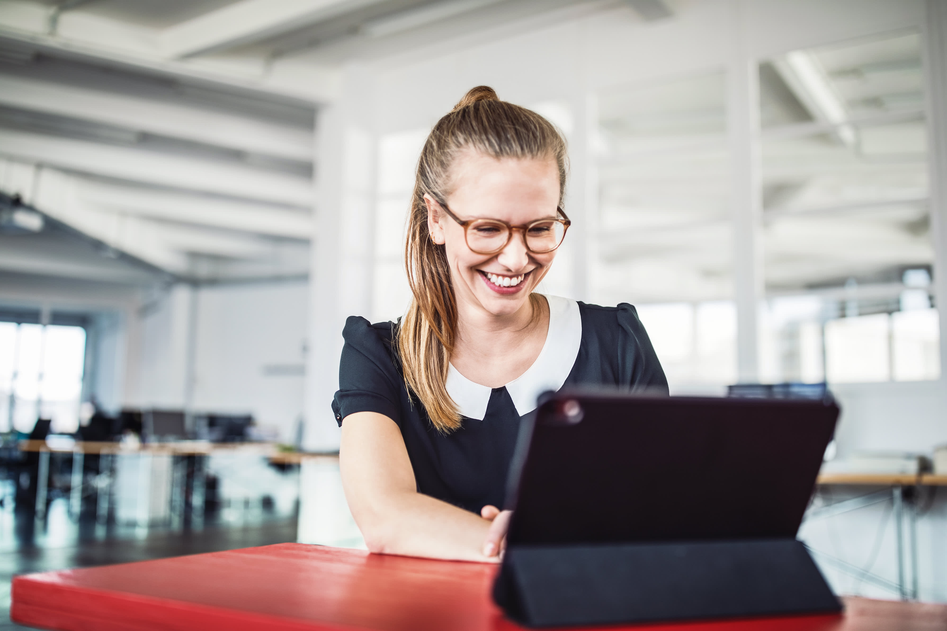 Young woman smiling during a video call in office