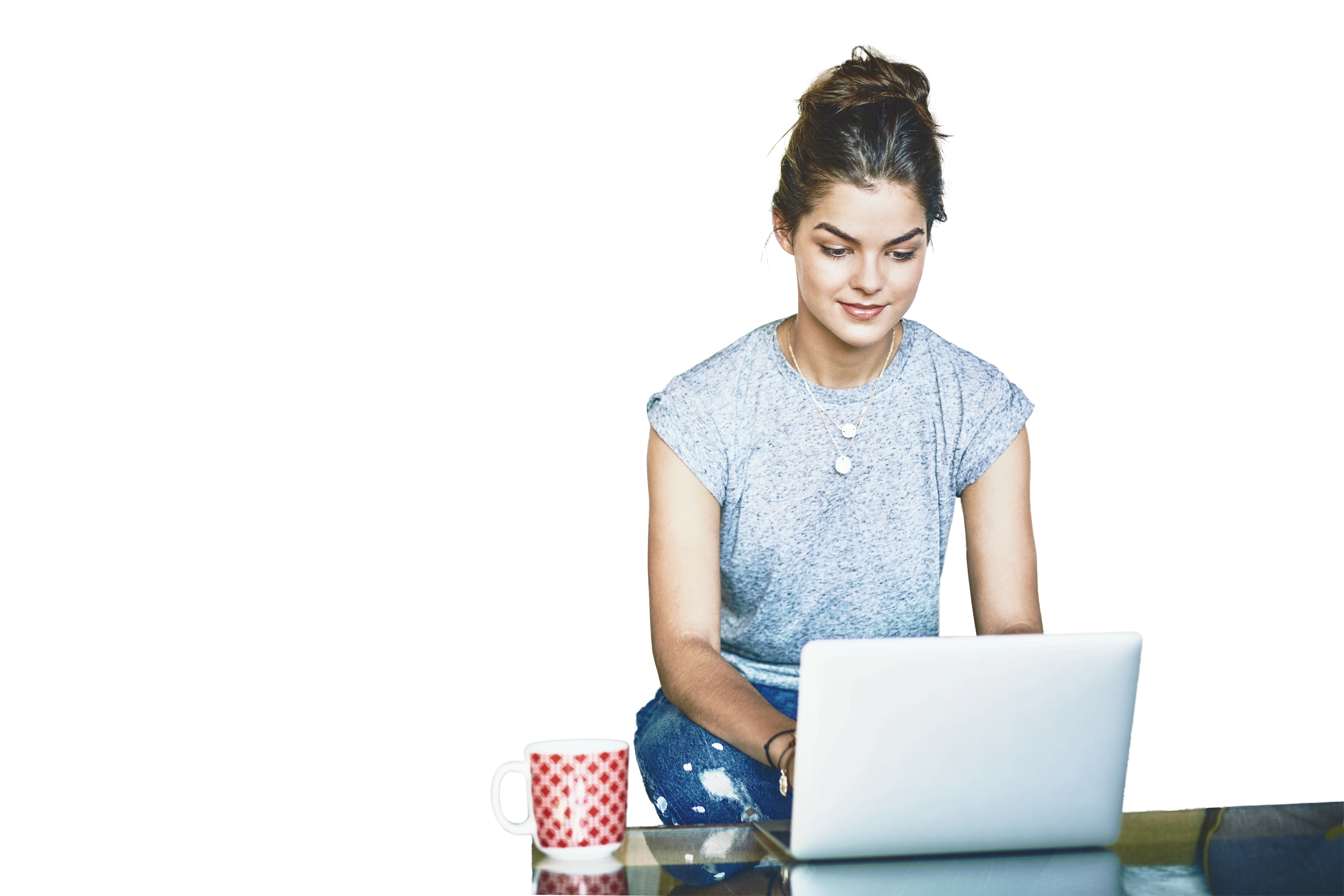 Beautiful female blogger using laptop at coffee table