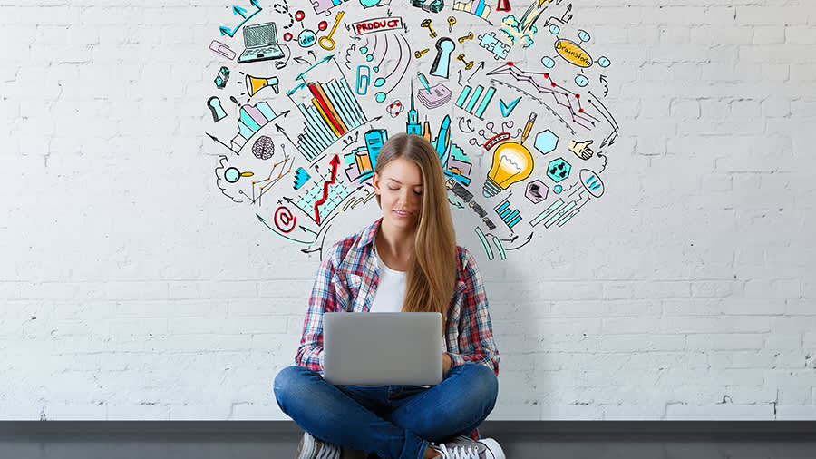 Student sit on the floor using a computer checking the status of her student visa aplication