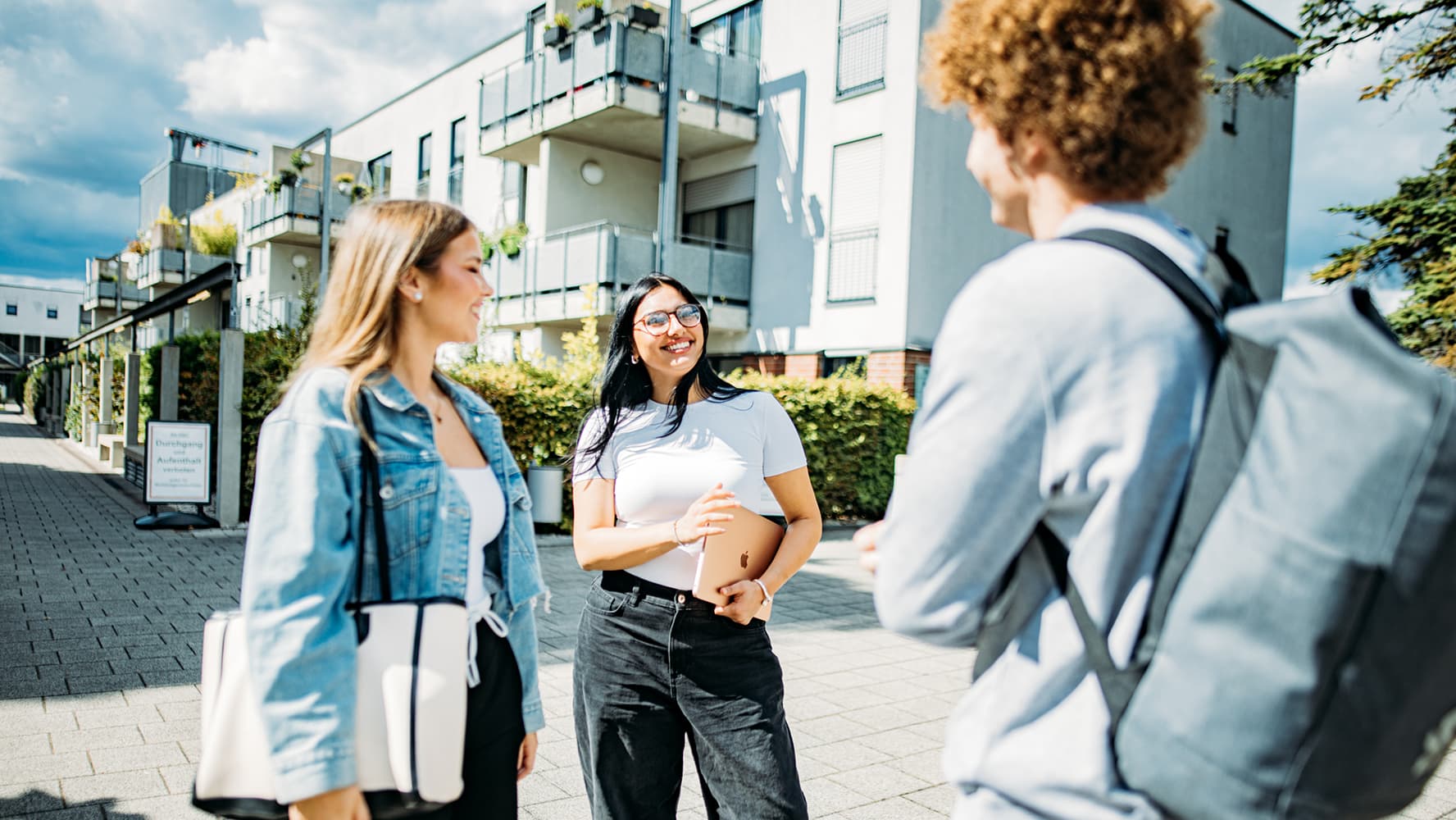Three IU students enjoying outdoors on a sunny day
