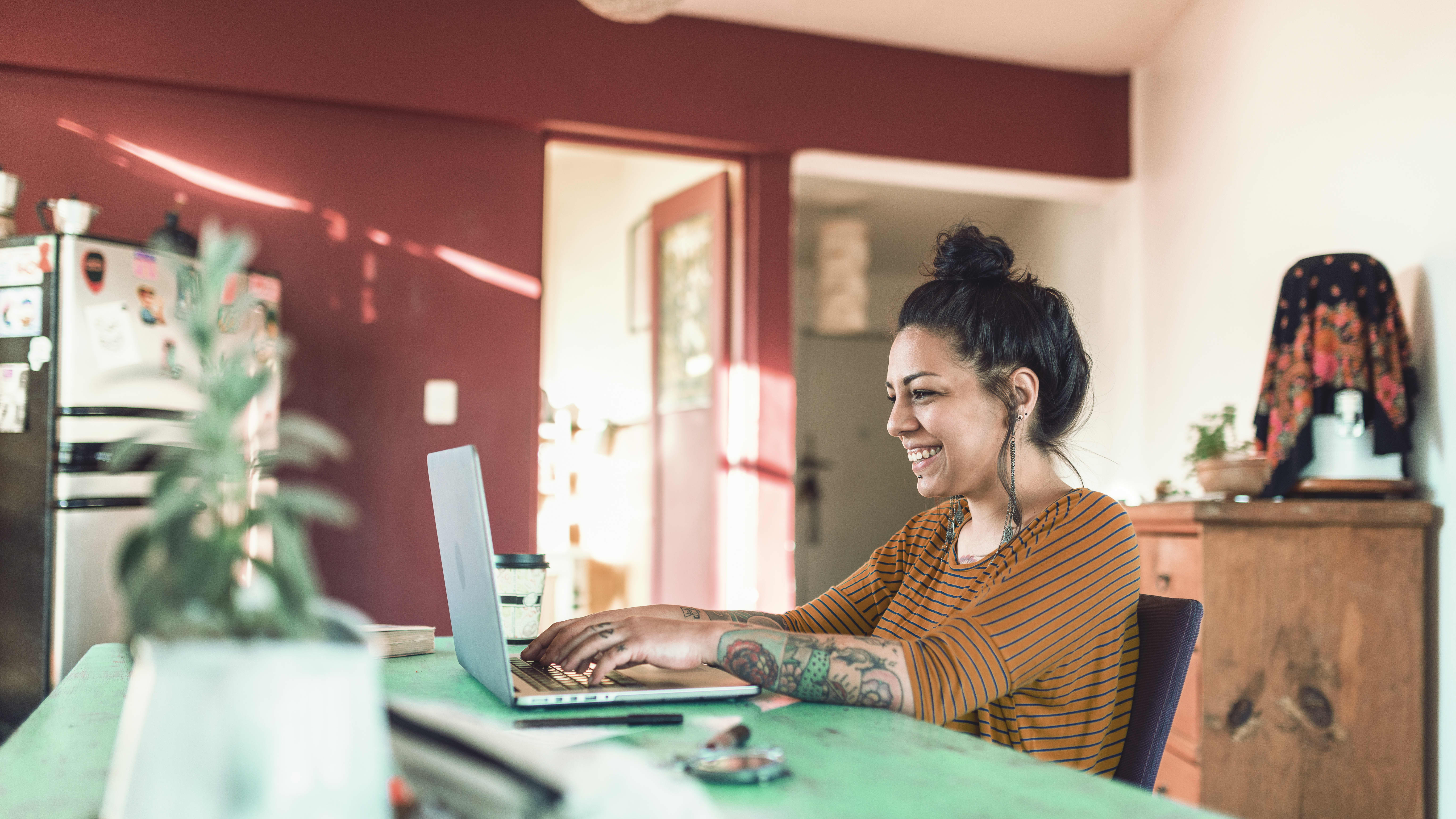Student using her laptop and AI at home