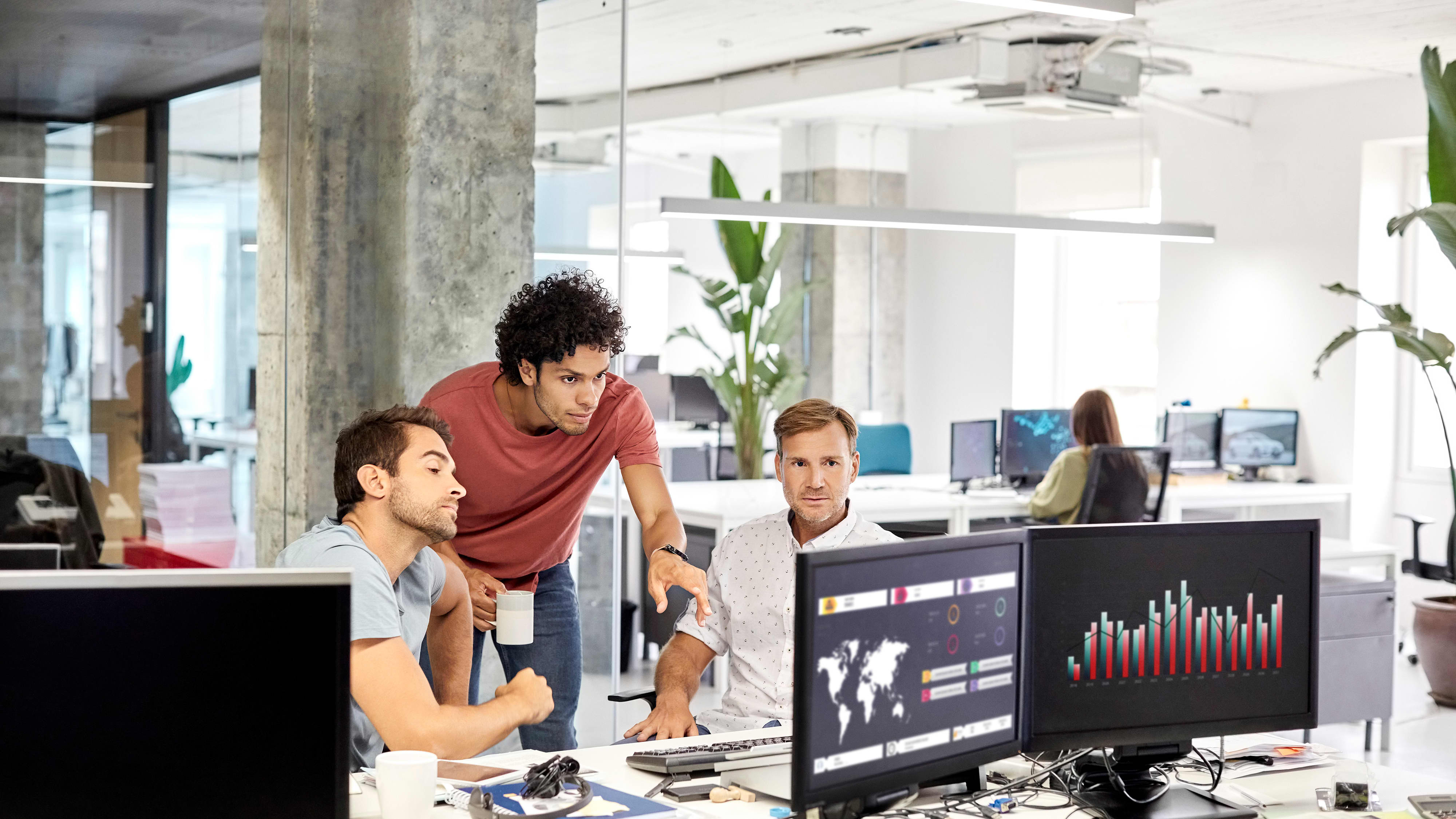 Group of three men having a meeting in an office
