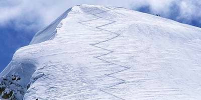 Snow-covered mountain peak symbolizing competence development