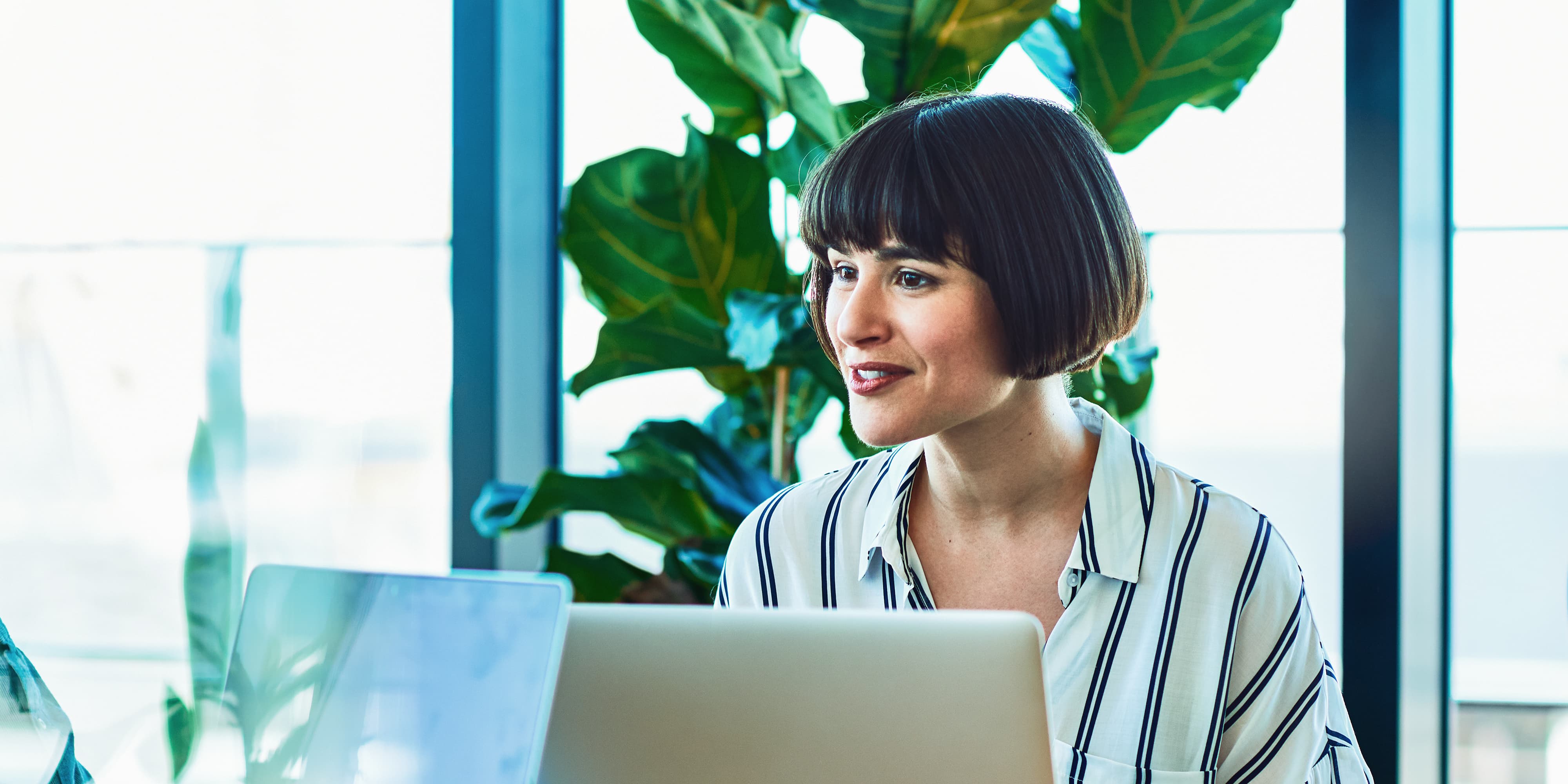 Woman with a laptop in an office