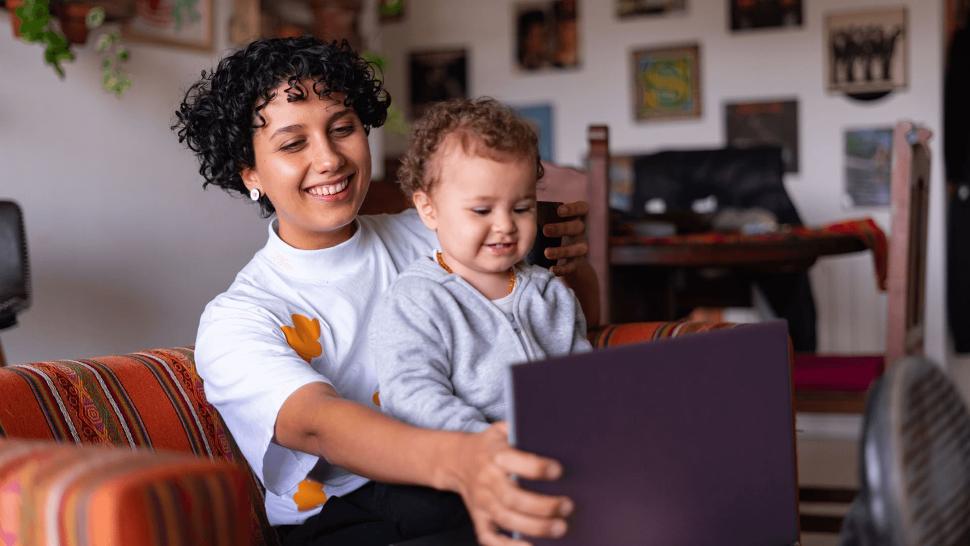 Mother with childe doing an online search for universities with technology degrees