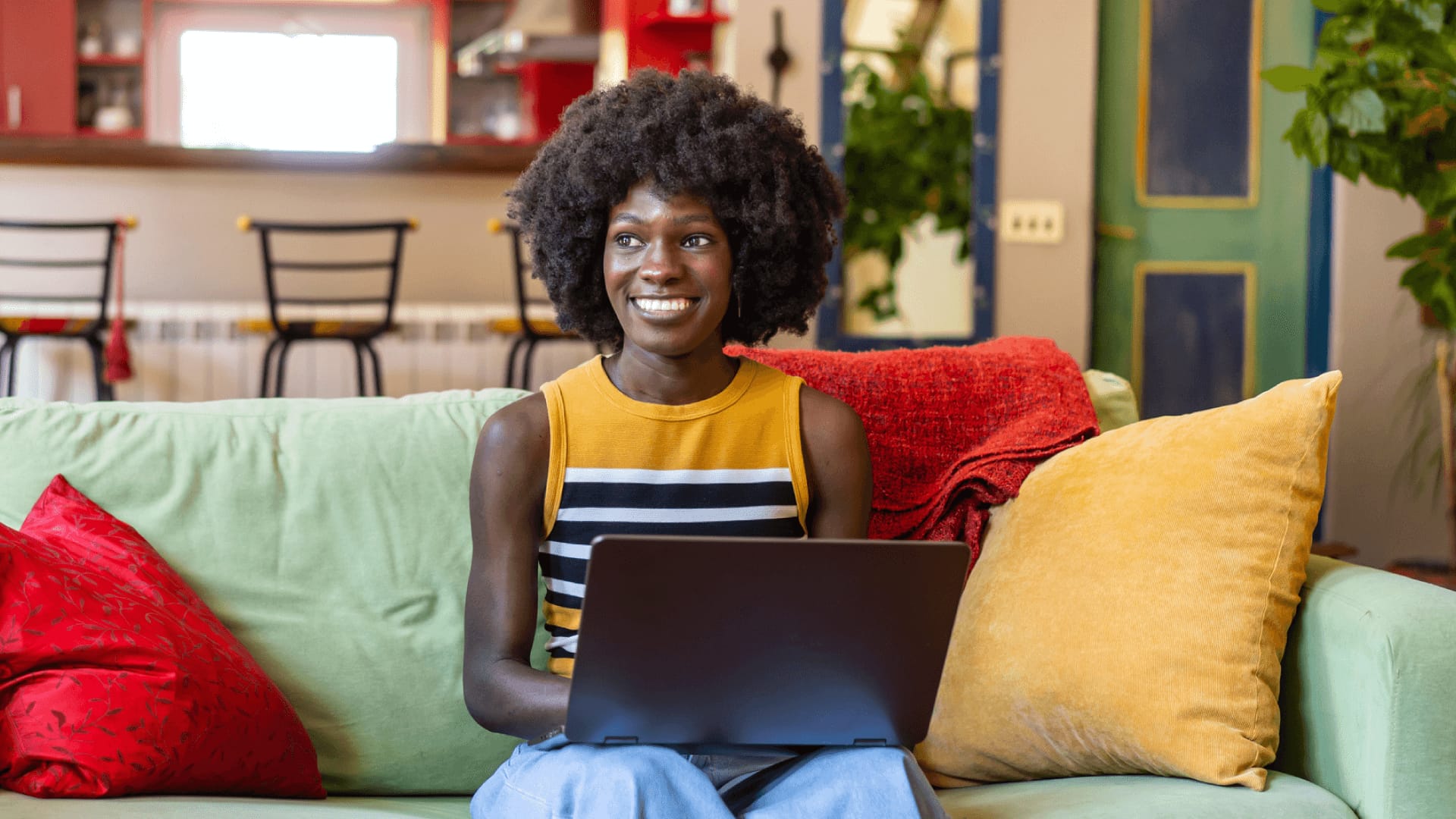 Smiling woman studying a distance learning course from home