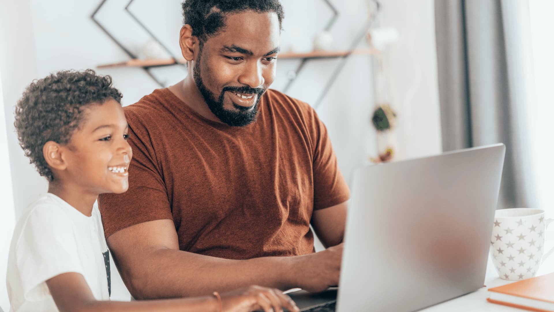 Distance learning student studying with family at home