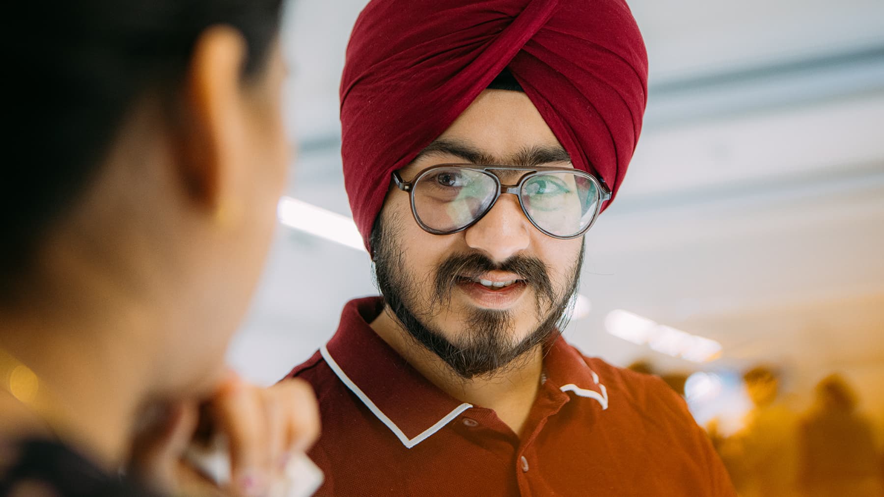 An Indian student chats with their classmate