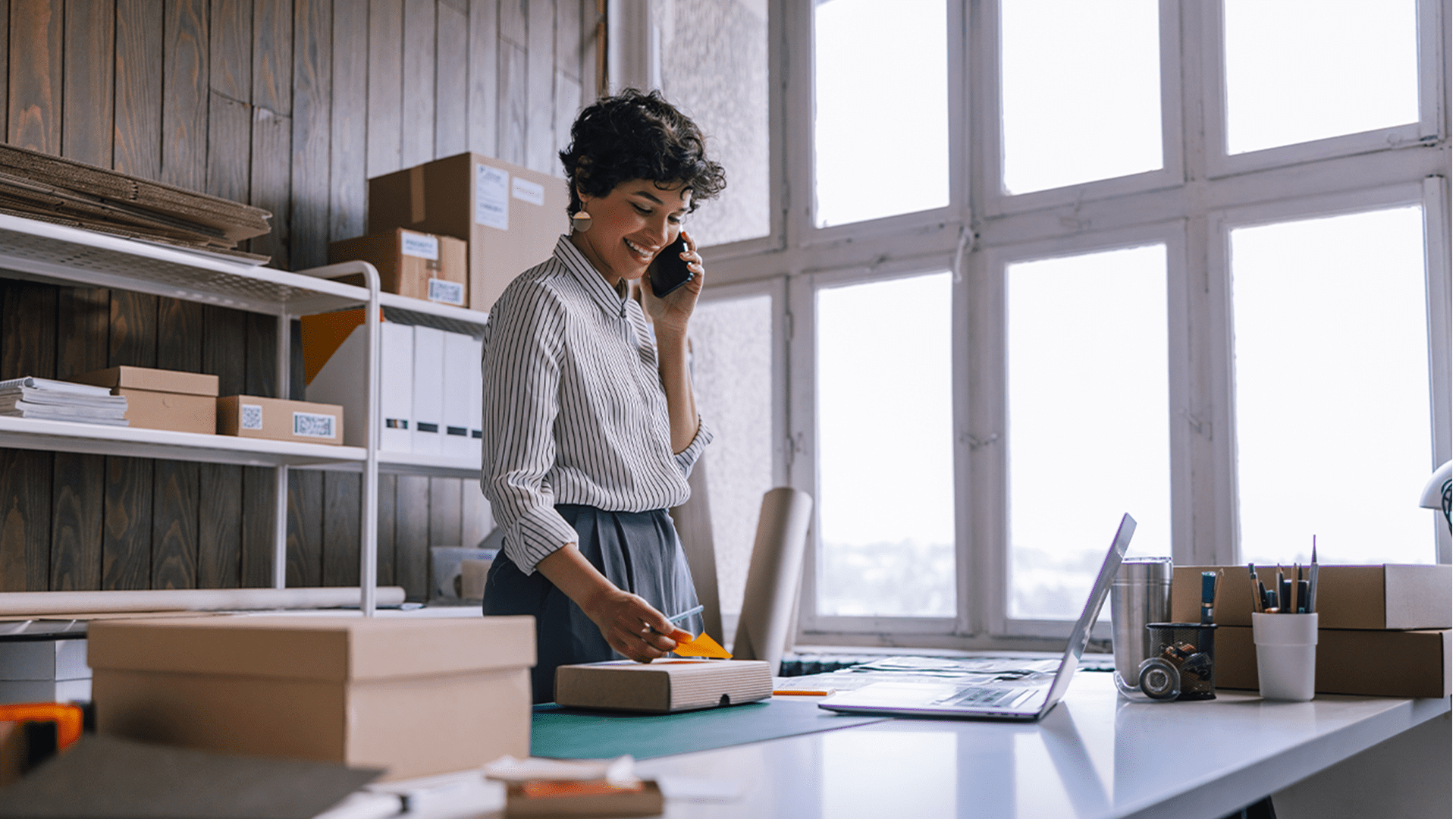 Woman in office talking on phone