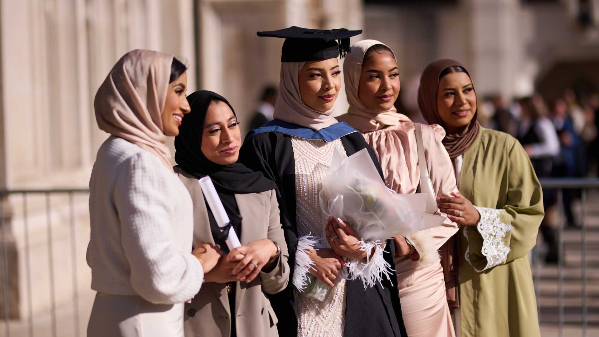 Group of Walbrook and LIBF graduates celebrate outside the London Guildhall