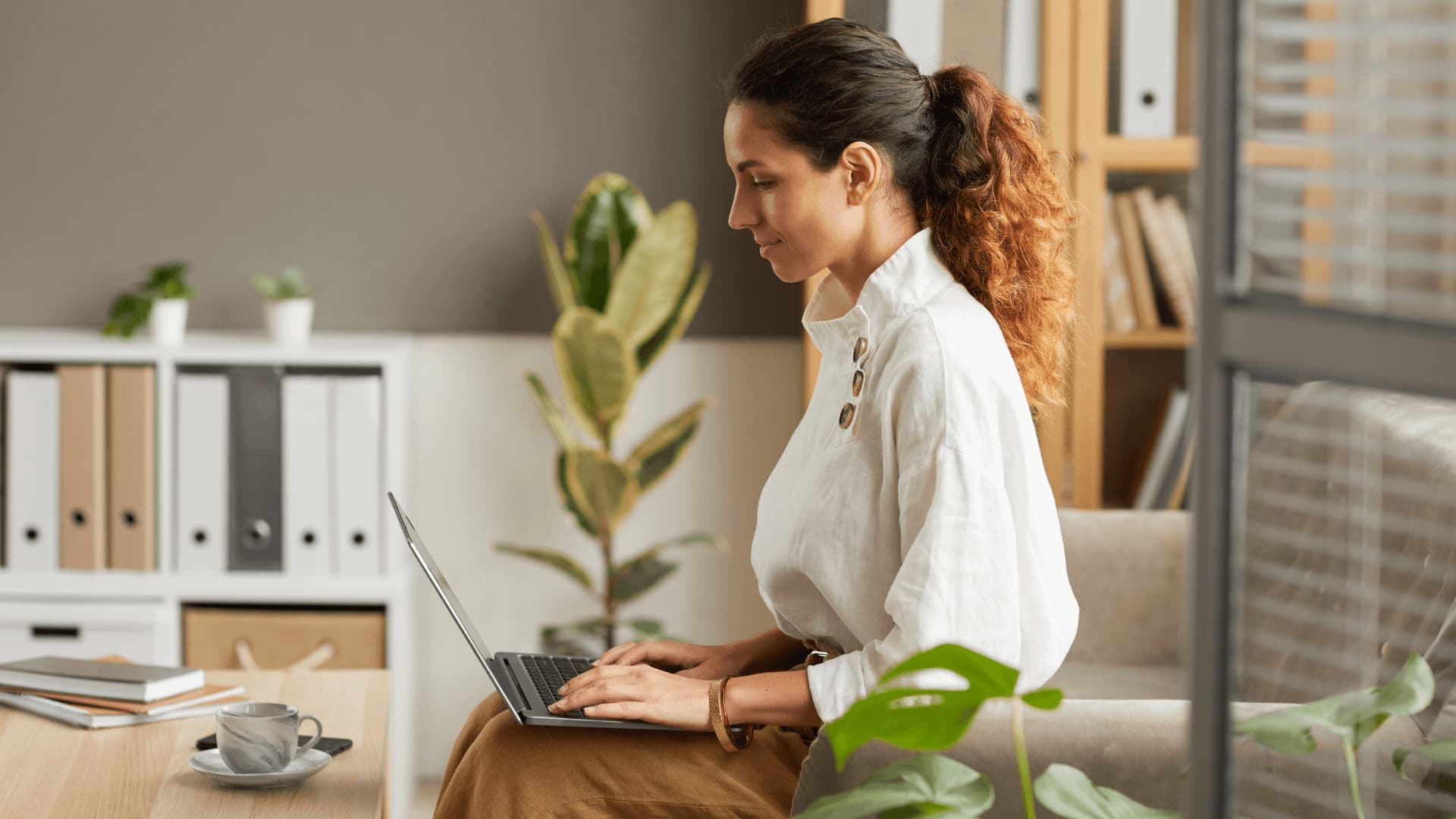 Curly hair business woman seems happy to provide support for business systems