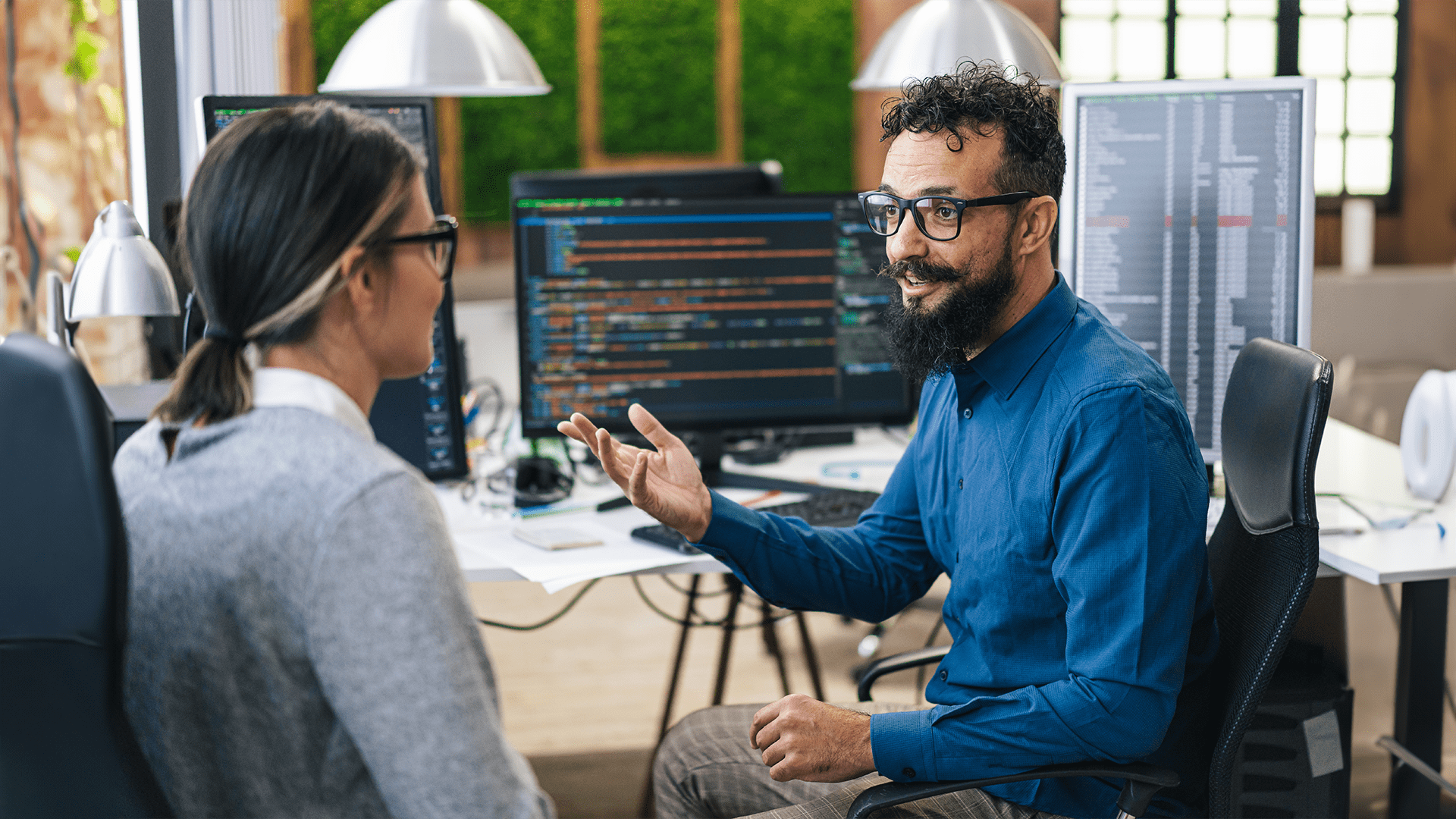 Software developers discussing opportunities for an aspiring software developer.