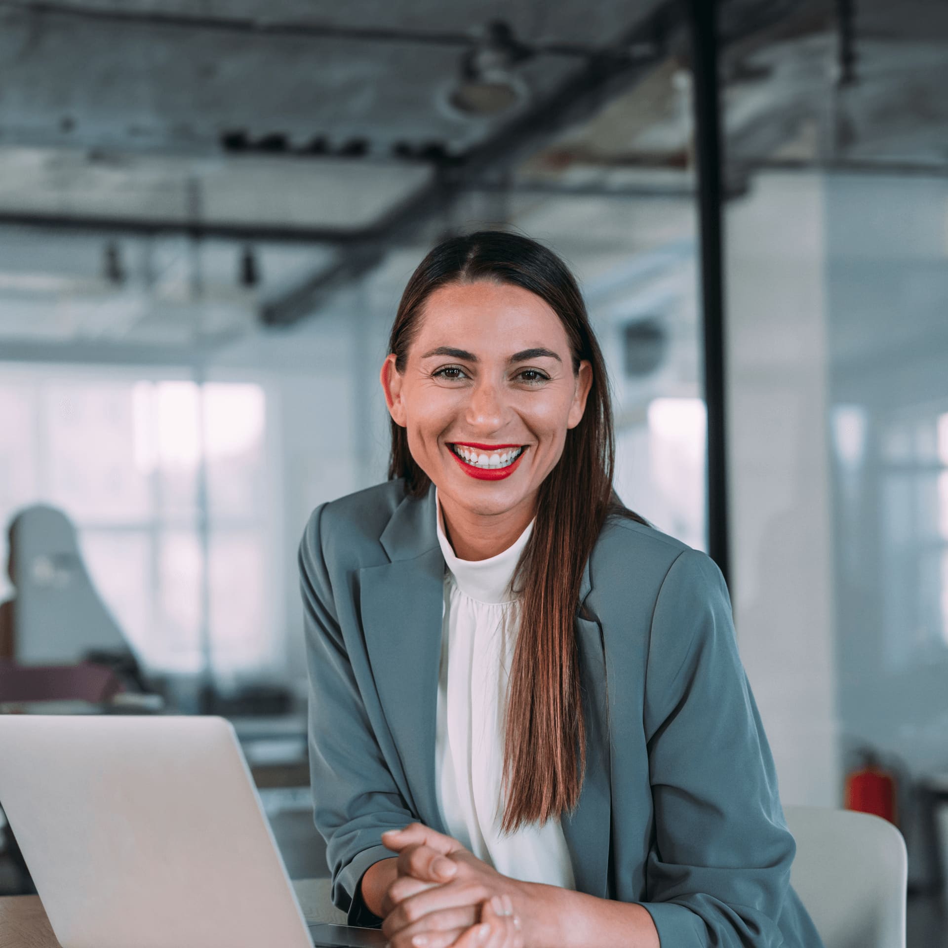 Smiling business woman in modern banking and insurance office.