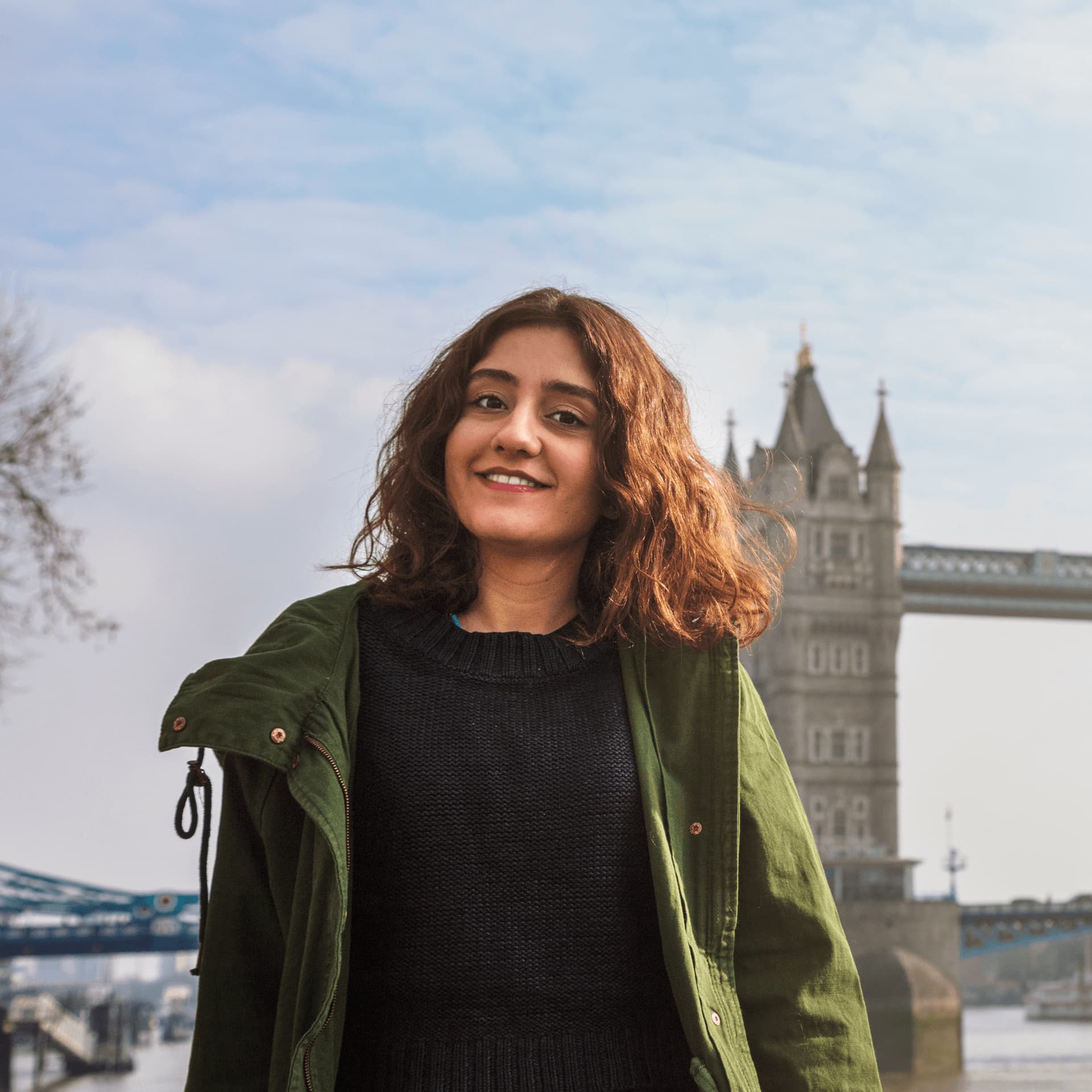 Young student stand in front of London Tower Bridge near LIBF.