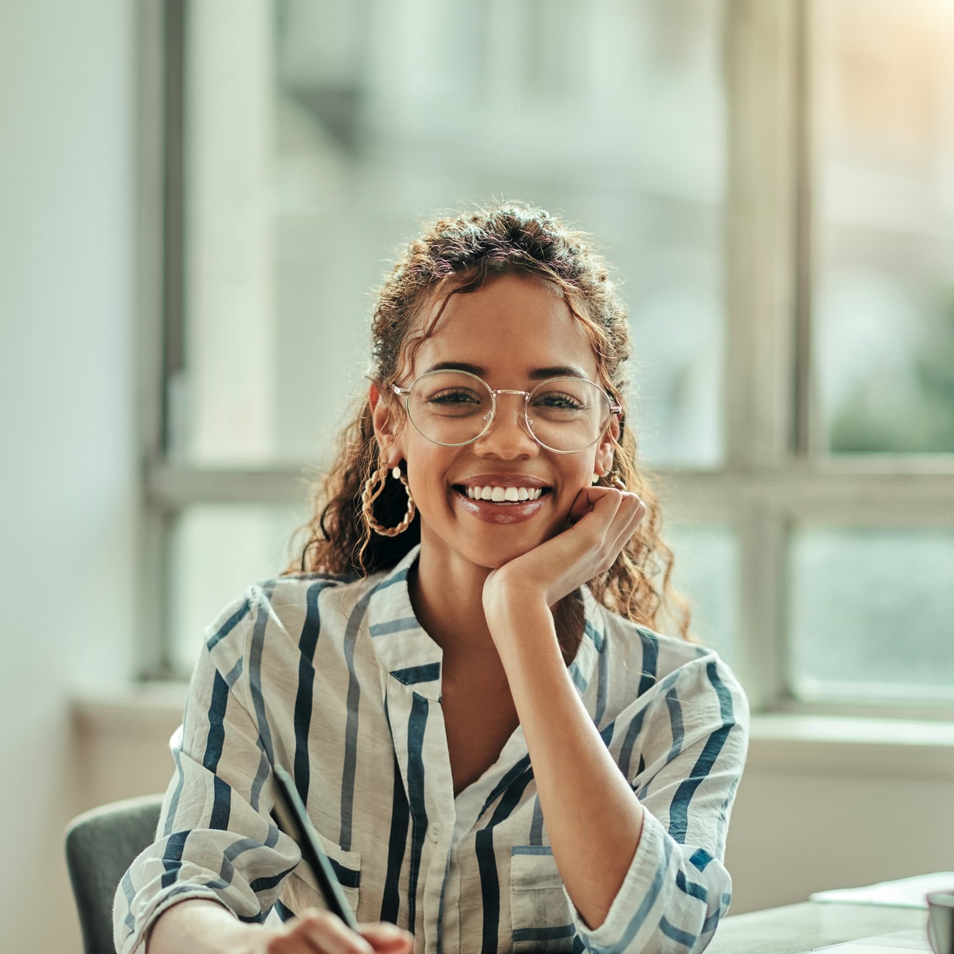 Woman learning how to become an IT consultant in home office with online degree.