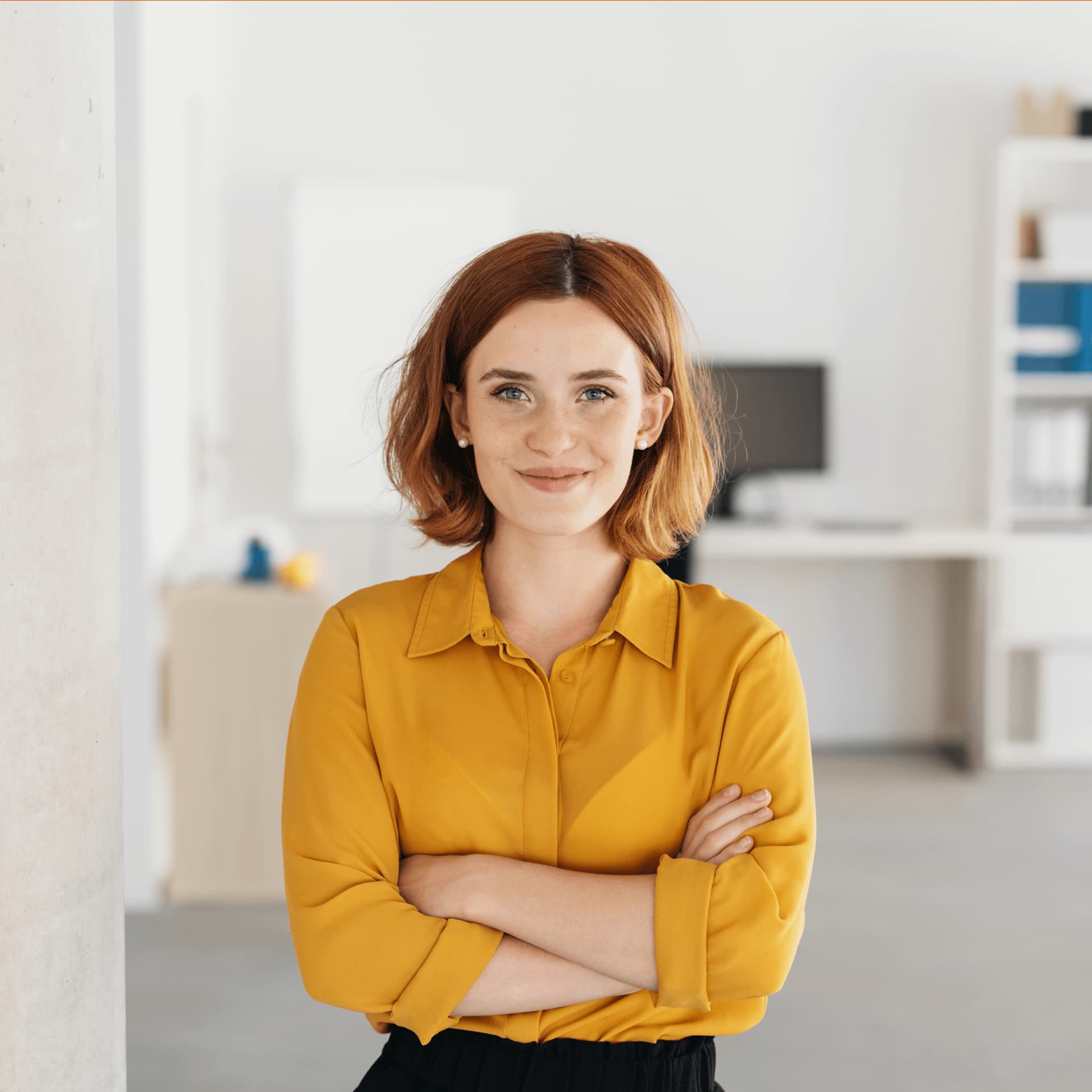 Woman wearing orange shirt is happy to take part in the group projects of the corporate recruiters.