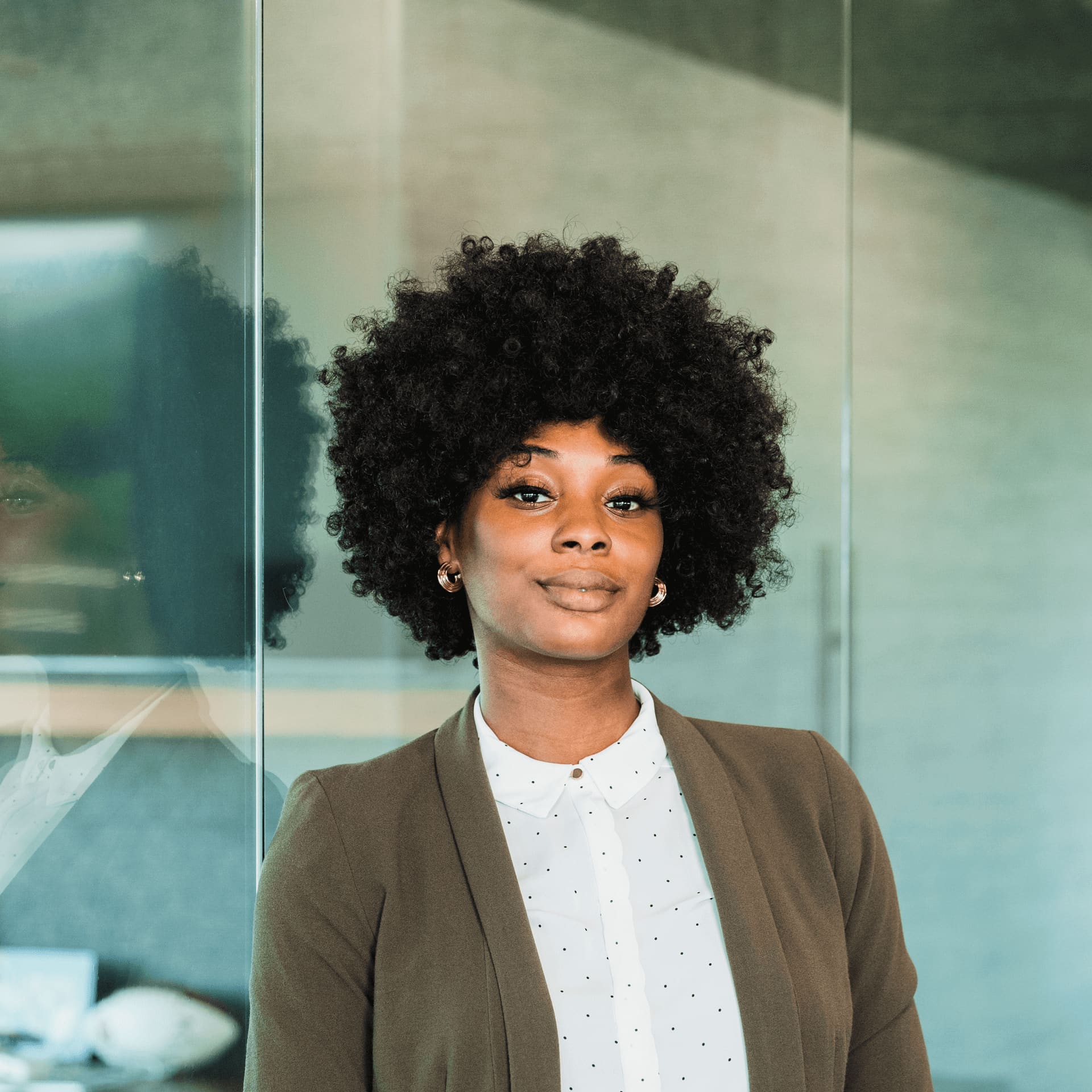 Business management student applying leadership skills to manage projects in a modern office setting.