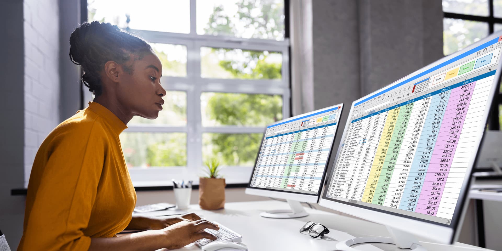Data professional ready to review required analytics on a computer, responsible for ensuring data quality and security. She’s engaged in data activities building knowledge through a detailed review.