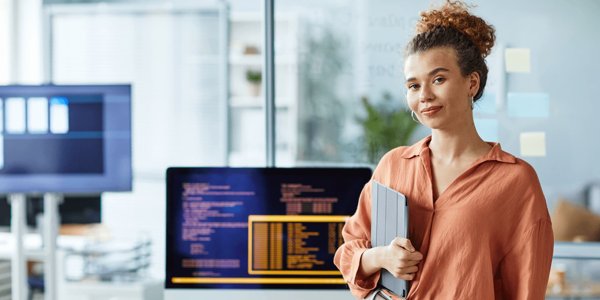 Female software developer in office after completing IT degree.