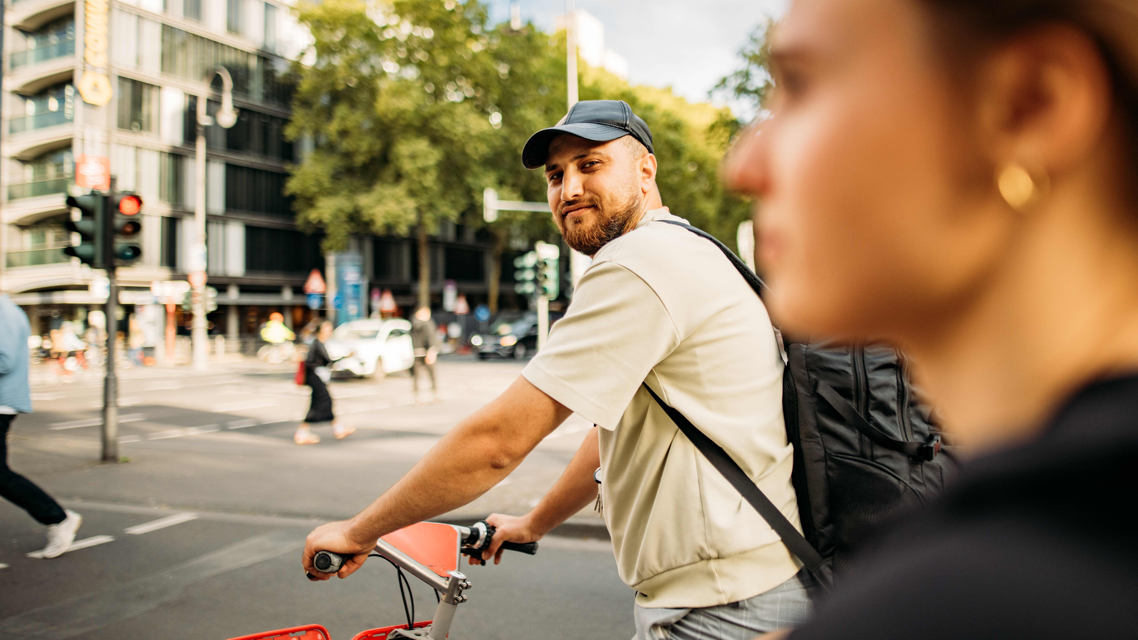 Young men using his bike around Köln