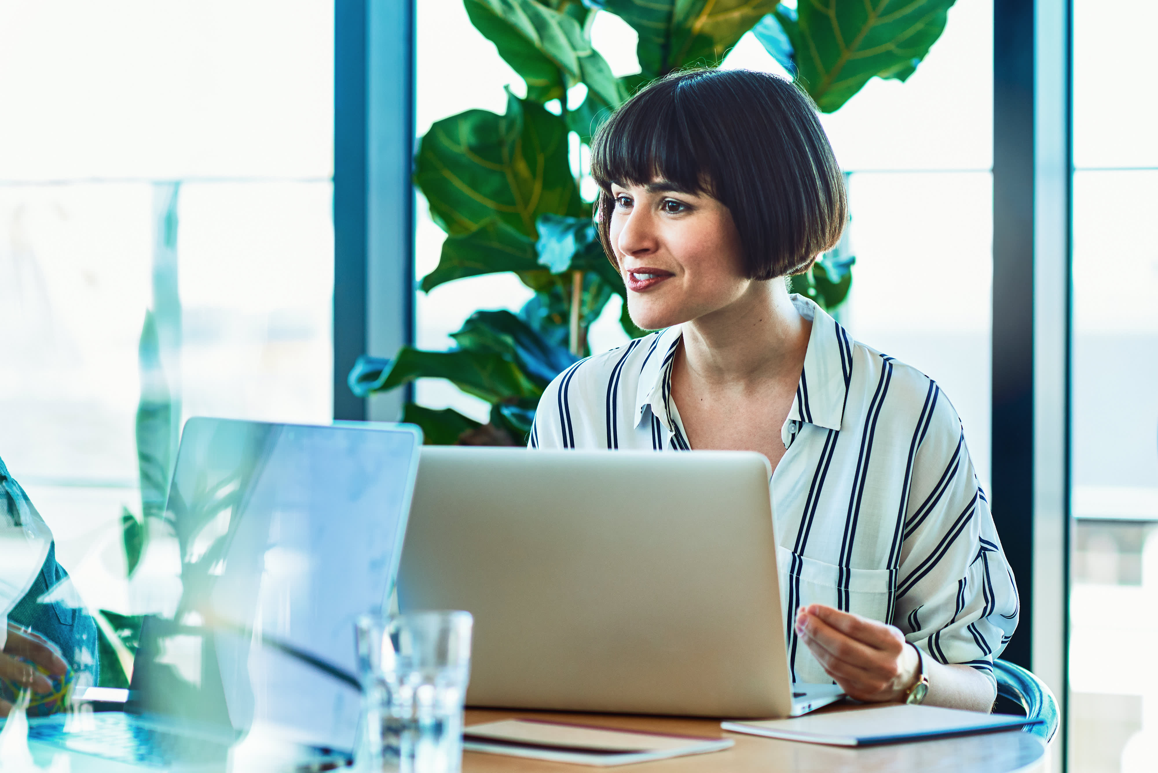 Woman with a laptop in an office