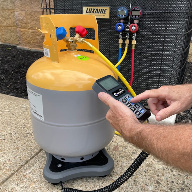 Mastercool Bluetooth scale in use with refrigerant cylinder and gauges during charging