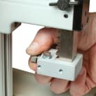 Adjustable upper and lower travel stops are useful for repetitive test requirements
