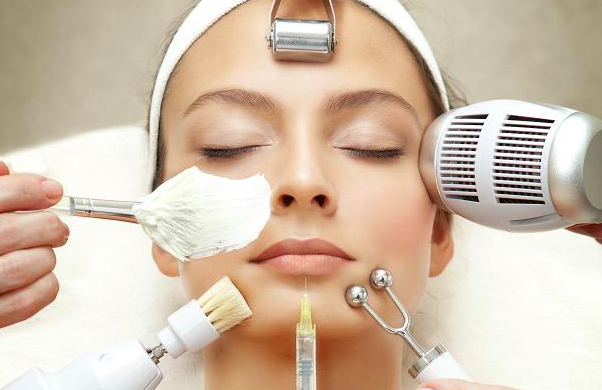 Therapist applying a treatment mask during a facial