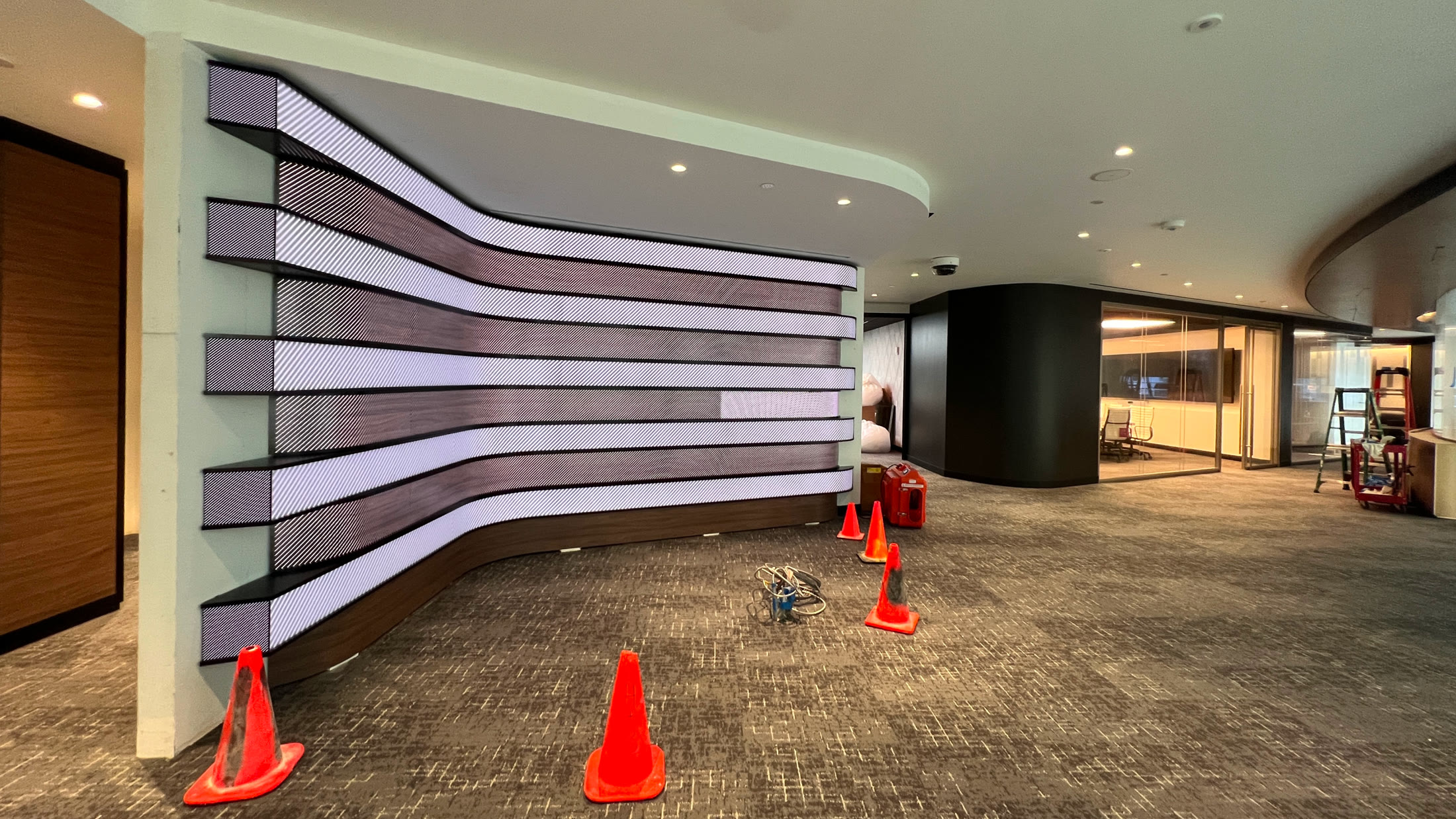 On site during install: a curved LED wall mid-commissioning