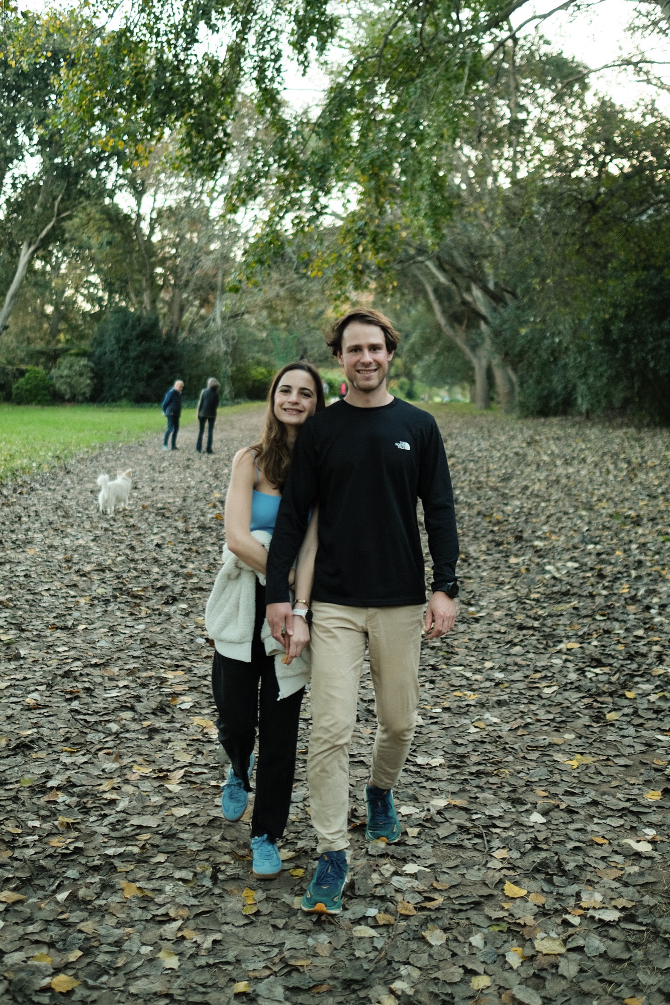 Tristan and Erin on an autumn walk under the trees
