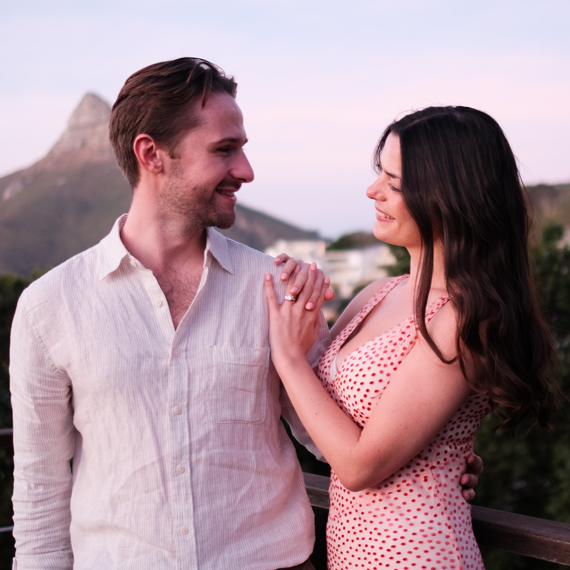 The newly engaged couple look at each other