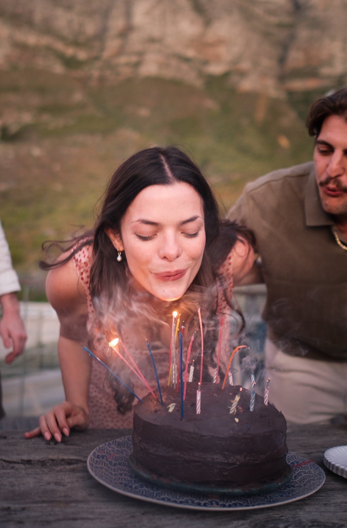 She blows out the birthday candles