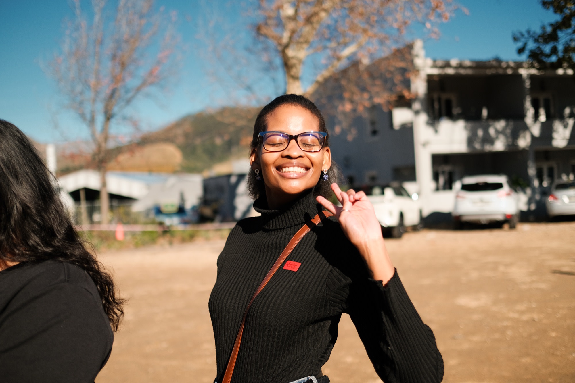 Kea throwing a peace sign in the winelands