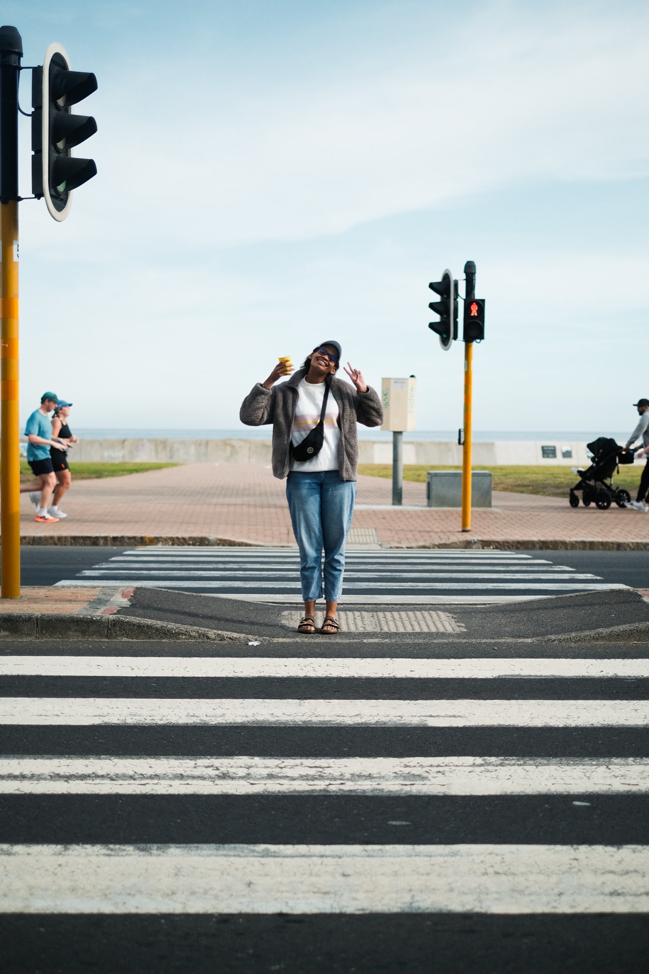 Kea crossing the promenade by the sea