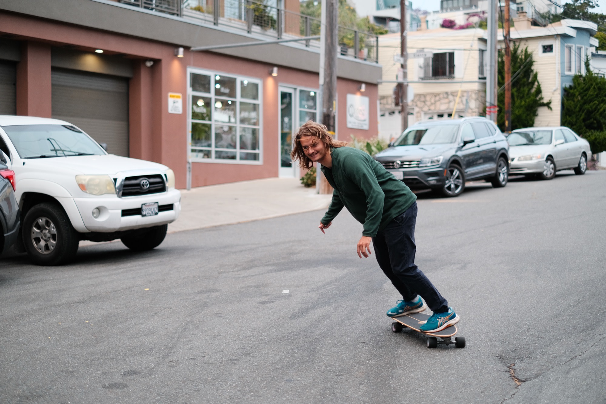 Laurence skating down a quiet neighbourhood street