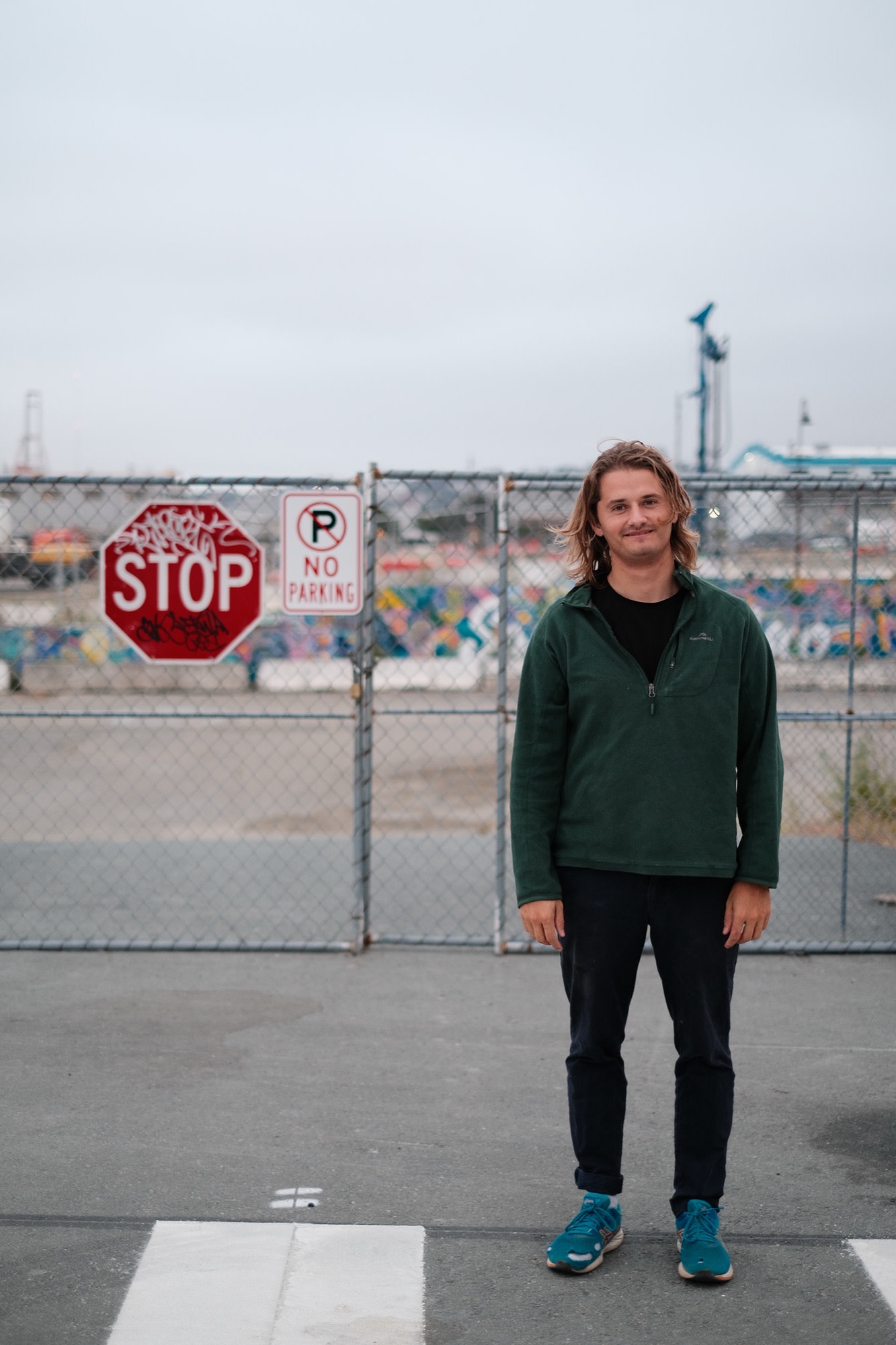 Laurence at an industrial lot by the bay